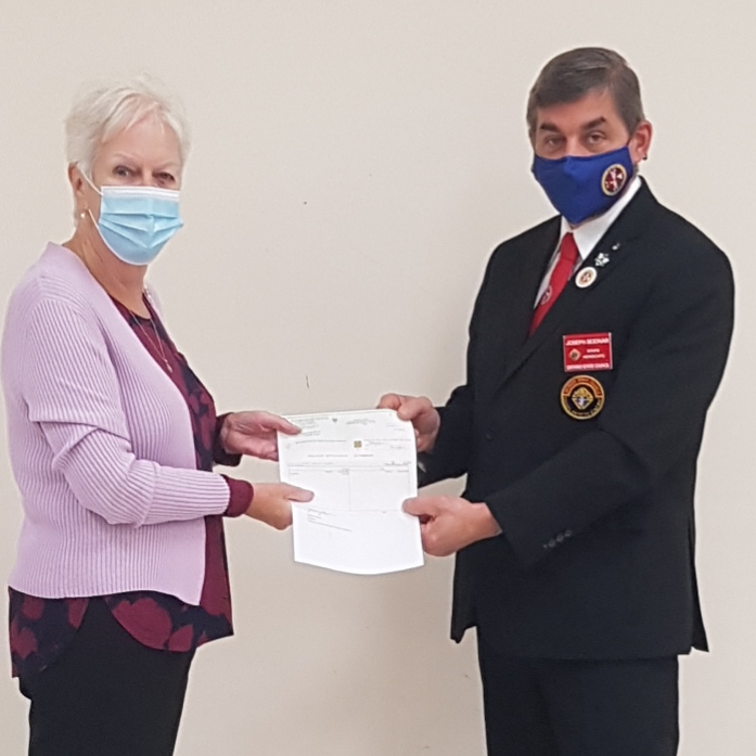 State Advocate, Joe Bodnar, presented the $1000 check to Marion Brady, President of St. Vincent de Paul (St. Joseph the Worker Conference Oshawa)