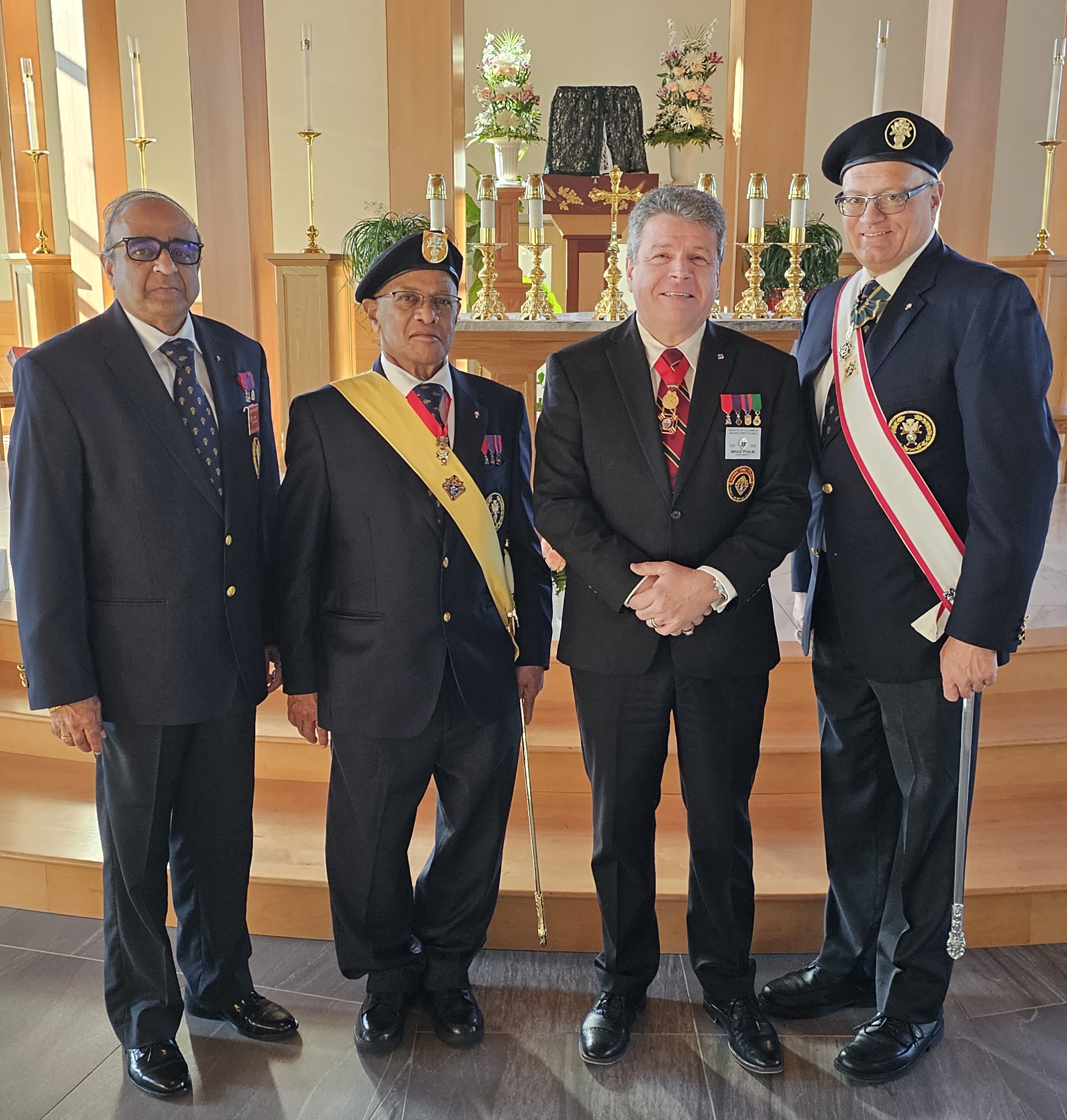 (LtoR) Faith Director and organizer of the Exemplification, Joseph Remedios, District 2 Master, Anthony D'Souza who was also celebrating his 78th birthday, State Deputy Bruce S. Poulin and Deputy Supreme Knight, Arthur Peters at the Fourth Degree Exemplification