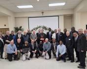 Council Chaplain Fr. David Twaddle, Grand Knight Ikenna Anyaehie, Fourth Degree members of the Msgr. Bench Assembly, and members of St. Joseph the Worker Council 9989 with Cardinal Leo.